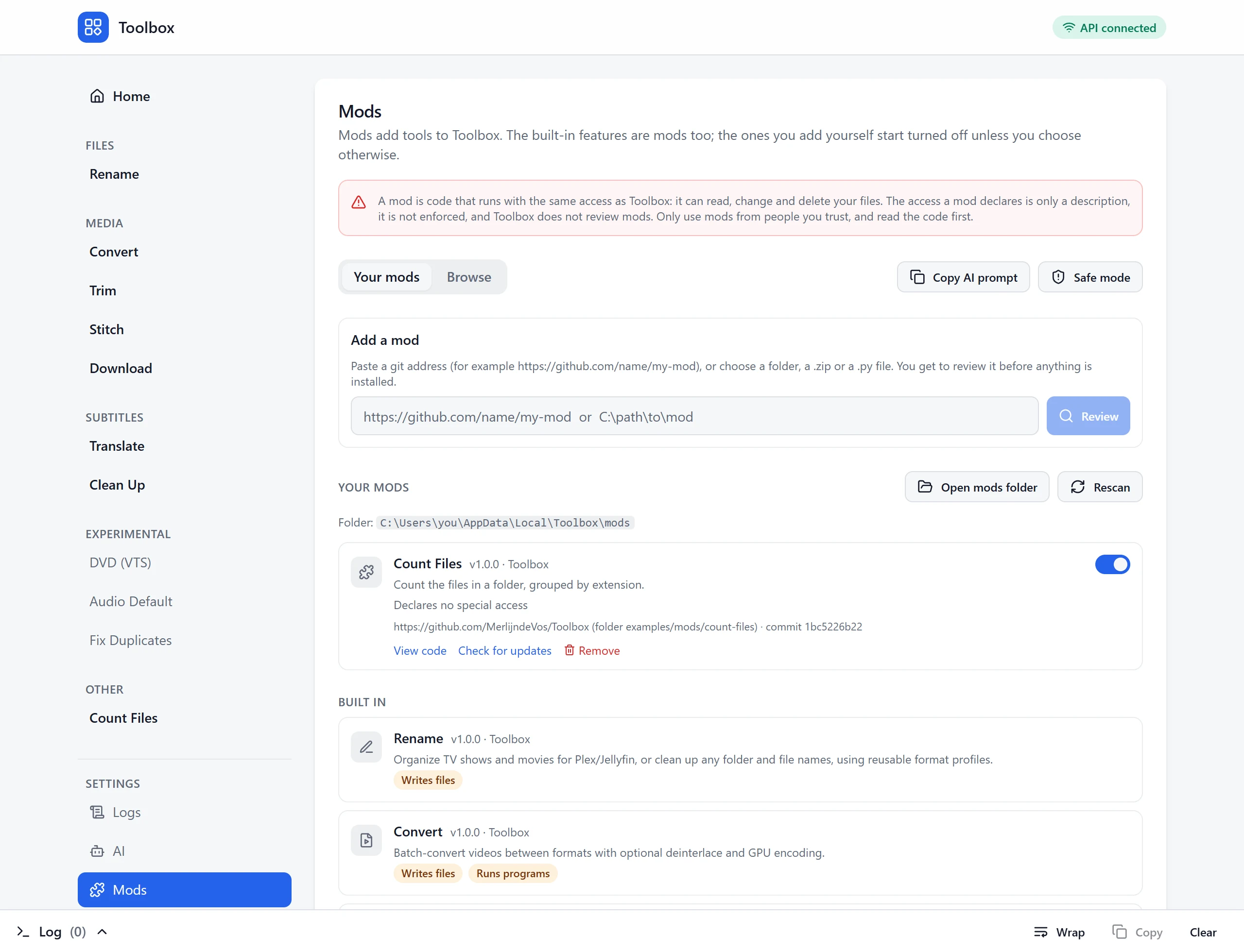 The Mods page: add a mod from a git address, folder or file, your own mods with an on/off switch, and the built-in tools with a note on what each one does.
